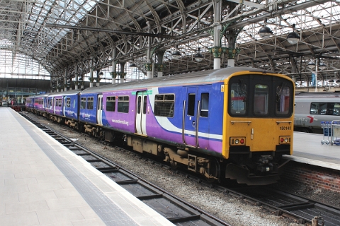 Northern class 150/1 no. 150143 with an unidentified class 156 on the rear at Manchester Piccadilly on 12th July 2015.