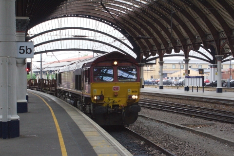 DB Cargo class 66/0 no. 66156 hauled a empty steel train southwards through York on 18th May 2016.