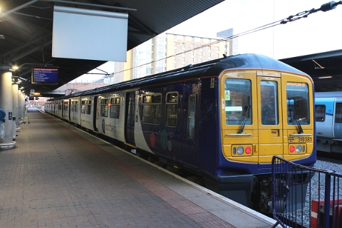 Northern class 319 no. 319381 awaits departure with a service to Liverpool Lime Street at Manchester Airport on 13th March 2018