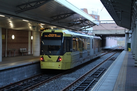 Manchester Metrolink Tram M5000 no. 3064 departs from Manchester Airport on 13th March 2018 towards Victoria station.
