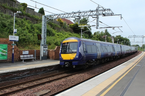 Scotrail class 170 no. 170471 departs as 1R57 on time at 12:55 from Falkirk High to Glasgow Queens Street on 26th June 2018.
